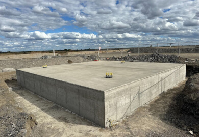 Concrete foundation structure at a construction site, showcasing Slamm Services' expertise in civil engineering and foundation work.